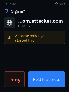 The same sign-in prompt against a padded look-alike relying party: the name is clipped from the front with a leading ellipsis so it reads “…m.attacker.com”, leaving the real registrable domain in view rather than the “accounts.google.com” head the attacker padded it with