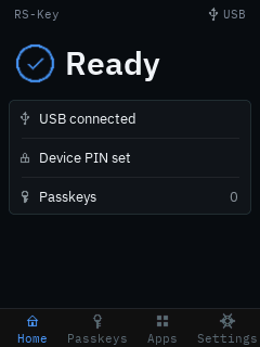 The trusted display’s Home screen: a bright “Ready” status beside a check, a status card reading USB connected / Device PIN set / Passkeys 0, and a bottom navigation bar with Home, Passkeys, Apps and Settings tabs