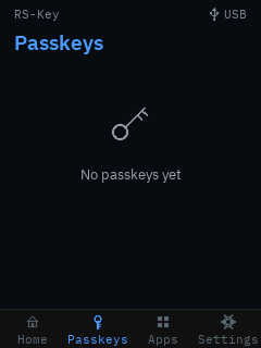 The trusted display’s Passkeys tab on a device with no resident credentials, showing a key glyph and the empty-state message “No passkeys yet”